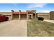 Charming single-story home with a well-maintained lawn and multiple car garage at 10014 E Michigan Ave, Sun Lakes, AZ 85248