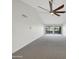 Room with large sliding glass doors overlooking the backyard at 10014 E Michigan Ave, Sun Lakes, AZ 85248