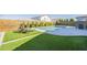 Backyard featuring a pool, patio area, well-manicured artificial grass and a wooden fence at 10134 E Supernova Dr, Mesa, AZ 85212