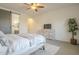 Spacious bedroom with neutral tones, barn door to bathroom, and modern decor at 10134 E Supernova Dr, Mesa, AZ 85212