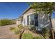 Attractive single-story home with a desert landscape, providing easy maintenance at 10134 E Supernova Dr, Mesa, AZ 85212