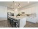 Beautiful kitchen with pendant lighting, stainless steel appliances, and a large center island at 10134 E Supernova Dr, Mesa, AZ 85212