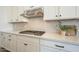 Modern kitchen with stylish backsplash, gas cooktop, and ample counter space with updated appliances at 10134 E Supernova Dr, Mesa, AZ 85212