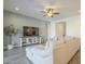 Cozy living room features a large sectional, modern entertainment center and neutral decor at 10134 E Supernova Dr, Mesa, AZ 85212