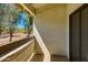 Private balcony with desert views, stucco walls, and wood railing is perfect for enjoying the outdoors at 10444 N 69Th St # 224, Paradise Valley, AZ 85253