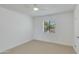 Comfortable bedroom featuring neutral carpeting and a view to the outside through large horizontal blinds at 10444 N 69Th St # 224, Paradise Valley, AZ 85253