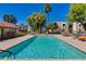 Inviting community pool surrounded by lush landscaping, lounge chairs, and ample seating areas at 10444 N 69Th St # 224, Paradise Valley, AZ 85253