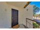 Inviting front entrance featuring a secure gate, textured walls, and a charming welcome mat at 10444 N 69Th St # 224, Paradise Valley, AZ 85253