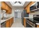 Well-equipped kitchen with wooden cabinets, stainless steel appliances, and an open layout at 10444 N 69Th St # 224, Paradise Valley, AZ 85253