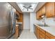 Modern kitchen with stainless steel appliances, ample counter space, and light wood cabinetry at 10444 N 69Th St # 224, Paradise Valley, AZ 85253