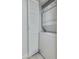 Convenient laundry closet with stacked washer and dryer, neatly tucked away behind louvered doors at 10444 N 69Th St # 224, Paradise Valley, AZ 85253