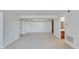 Expansive living room featuring bright white walls, plush carpeting, and multiple entryways at 10444 N 69Th St # 224, Paradise Valley, AZ 85253