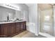 Spacious bathroom featuring a double sink vanity, tub, and walk-in shower at 11502 E Rafael Ave, Mesa, AZ 85212