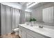 Bathroom with a double sink vanity, shower, and neutral walls at 11502 E Rafael Ave, Mesa, AZ 85212