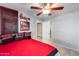 Bedroom with ceiling fan, a view to the hallway, and a Husker theme at 11502 E Rafael Ave, Mesa, AZ 85212