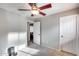 Bedroom with wood-tone ceiling fan and a nearby doorway to the rest of the home at 11502 E Rafael Ave, Mesa, AZ 85212