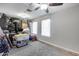 Bonus room with storage area, ceiling fan, and natural light from two windows at 11502 E Rafael Ave, Mesa, AZ 85212
