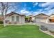 Inviting single-story home with a well-manicured lawn, desert landscaping, and a two-car garage at 11502 E Rafael Ave, Mesa, AZ 85212