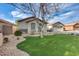 Charming single-level home with a well-maintained lawn, low-maintenance landscaping, and a cozy curb appeal at 11502 E Rafael Ave, Mesa, AZ 85212