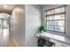 View of the hallway with a built-in desk, perfect for a home office or study area at 11502 E Rafael Ave, Mesa, AZ 85212