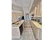 Bright kitchen featuring an island, light wood cabinets, and modern appliances at 11645 E Bella Vista Dr, Scottsdale, AZ 85259