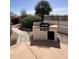 Built-in outdoor kitchen featuring a grill, counter space, and easy access to the patio at 11645 E Bella Vista Dr, Scottsdale, AZ 85259