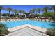 Expansive community pool with multiple lap lanes, seating, and lush landscaping at 11645 E Bella Vista Dr, Scottsdale, AZ 85259