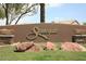 Elegant Stonegate community sign with well-maintained landscaping and decorative planters at 11645 E Bella Vista Dr, Scottsdale, AZ 85259