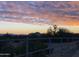 Expansive desert sunset view featuring a colorful sky with pink clouds and mountain silhouettes at 11645 E Bella Vista Dr, Scottsdale, AZ 85259