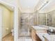 Bathroom featuring walk-in shower, sink with granite countertop, and toilet in separate room at 11837 N 40Th Pl, Phoenix, AZ 85028