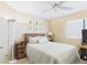 Cozy bedroom with ceiling fan, natural light, and botanical wall art at 11837 N 40Th Pl, Phoenix, AZ 85028