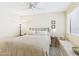 Bedroom featuring a cozy bed, window seat, and ceiling fan at 11837 N 40Th Pl, Phoenix, AZ 85028