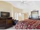 Main bedroom boasts a bed, ceiling fan, and ample storage with built-in dresser at 11837 N 40Th Pl, Phoenix, AZ 85028