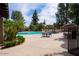 Resort-style pool area with tables, seating, and well-maintained landscaping at 11837 N 40Th Pl, Phoenix, AZ 85028