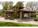 A tile-roofed poolside pavilion offers shade and seating next to the pool and green space at 11837 N 40Th Pl, Phoenix, AZ 85028