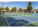 Well-maintained tennis courts with benches, nets, and lights for evening play at 11837 N 40Th Pl, Phoenix, AZ 85028
