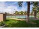 Exterior view of community tennis courts, surrounded by lush greenery at 11837 N 40Th Pl, Phoenix, AZ 85028