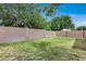 Spacious backyard featuring a well-maintained lawn and a tall block wall offering privacy at 12048 W Dahlia Dr, El Mirage, AZ 85335