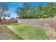 This backyard features a spacious grassy area and a block wall at 12048 W Dahlia Dr, El Mirage, AZ 85335