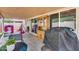 This backyard features a covered patio, a grill, and play equipment at 12048 W Dahlia Dr, El Mirage, AZ 85335