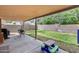 Backyard with a covered patio and lawn at 12048 W Dahlia Dr, El Mirage, AZ 85335