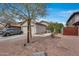 Charming home with a two-car garage, desert landscaping, and a tiled roof, offering curb appeal and low maintenance at 12048 W Dahlia Dr, El Mirage, AZ 85335