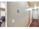 Hallway featuring hardwood floors and neutral walls, leading to various rooms within the home at 12048 W Dahlia Dr, El Mirage, AZ 85335