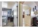 Hallway view showcasing access to a bedroom and kitchen area, highlighting the home's layout at 12048 W Dahlia Dr, El Mirage, AZ 85335