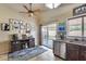Bright eat-in kitchen area with stainless steel dishwasher, and sliding doors to outdoor patio at 12048 W Dahlia Dr, El Mirage, AZ 85335