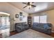 Bright living room features neutral walls, dark wood floors, and a large window, perfect for comfortable living at 12048 W Dahlia Dr, El Mirage, AZ 85335