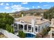 Luxury home with pool, outdoor seating, and desert landscaping with mountain views at 12055 E Clinton St, Scottsdale, AZ 85259