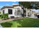 Manicured backyard boasts an elegant spiral staircase and a covered patio area at 12055 E Clinton St, Scottsdale, AZ 85259