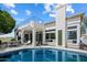 Lovely backyard with sparkling pool, covered patio, and a wrought iron staircase at 12055 E Clinton St, Scottsdale, AZ 85259