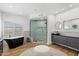Beautiful bathroom featuring a freestanding tub, glass shower, and modern vanity with black fixtures at 12055 E Clinton St, Scottsdale, AZ 85259